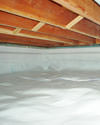 a moisture barrier installed on the walls and floors of a crawl space in Jackson Heights