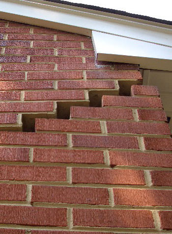 photo of a rotating foundation wall with cracks in Middle Village
