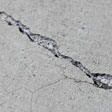 sinking outdoor concrete in need of mudjacking in Brooklyn