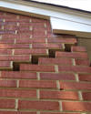 Serious damage to a foundation wall due to settlement of a home in Rego Park