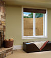 An egress window well installed within a finished basement space in Elmhurst.
