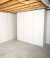 Fiberglass insulated basement wall system in Forest Hills, NY