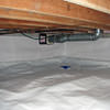 A heating duct extends along this sealed crawl space in Flushing.