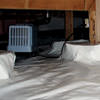 An energy efficient crawl space dehumidifier installed in a sealed crawl space in Jackson Heights.