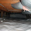 A sealed crawl space with an insulated hot air duct in Bronx.