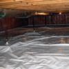 A sealed crawl space with support posts showing in Manhattan.