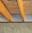 SilverGlo™ insulation installed in a floor joist in Forest Hills