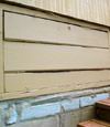an old-fashioned crawl space door in Whitestone about to be replaced