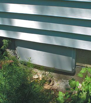 A gray crawl space vent cover in Far Rockaway