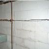 Severe foundation damage from a long crack in a bucking wall of a Ozone Park home.