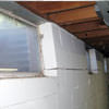 A foundation showing severe inward buckling along the windows in a Bayside home.