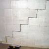 A diagonal stair step crack along the foundation wall of a Fresh Meadows home