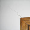 wall cracks along a doorway in a Ozone Park home.