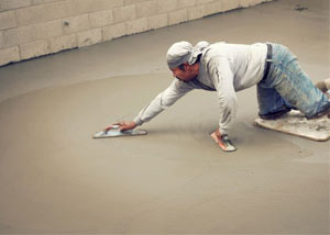 smoothing out the grout in a slab releveling project in Astoria