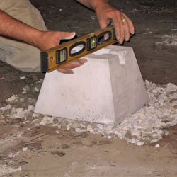 Placing the concrete footer for a crawl space jack post