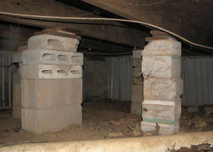 crawl space repairs done with concrete cinder blocks and wood shims in a Fresh Meadows home