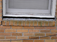 A window sill cracking and separating from the foundation wall in a Whitestone home.