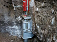 Foundation repair contractors lifting a structure in New York City.