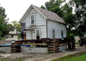 A severely damaged home foundation that is undergoing replacement in Oakland Gardens.