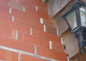 a repaired chimney in Far Rockaway that had shown serious foundation damage and was repaired with a helical pier system.