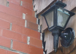 A tilting chimney in Far Rockaway showing serious foundation damage.