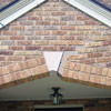 Major tuckpointing on a home archway over a door, with tuckpointing several inches wide that has failed on a Brooklyn home