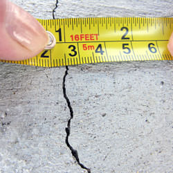 A crack in a poured concrete wall that's showing a normal crack during curing in Sunnyside