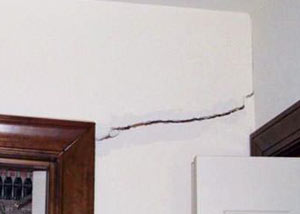 A large drywall crack in an interior wall in Flushing