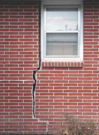 severe foundation wall cracks along a window in Oakland Gardens