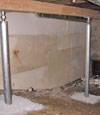 A system of crawl space support posts adding structural support to a crawl space in Sunnyside