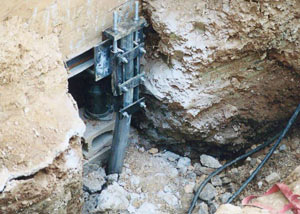 a bent, failed foundation push pier installed in Bronx.