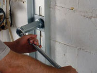 Mounting a foundation wall channel anchor in Astoria.