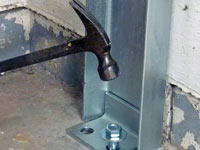Mounting a foundation channel anchor installation to the floor in Astoria.