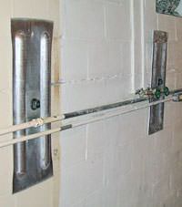 A foundation wall anchor system used to repair a basement wall in Woodhaven