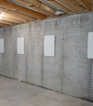Wall anchor covers covering a foundation wall repair system in Woodside, Jackson Heights, Forest Hills, Ozone Park, Bayside, Far Rockaway, Fresh Meadows
