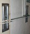 Foundation wall anchor plates installed in a basement in Bronx