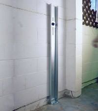 A failing foundation wall repaired with a foundation wall channel anchor system in a Staten Island home.