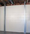 A steel i-beam system installed on a Rockaway Park foundation wall