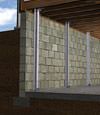 I-beam foundation wall supports installed in a Long Island City basement.