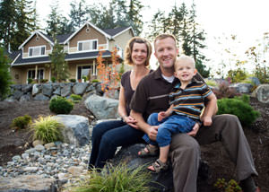 A happy family outside a home with a repaired foundation in Maspeth
