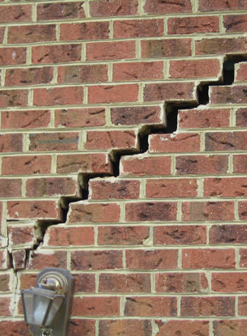 major cracking of a brick foundation wall in Middle Village