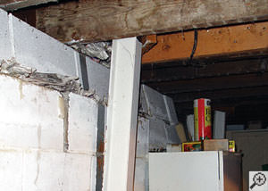 A failing foundation wall and i-beam support in a Brooklyn home