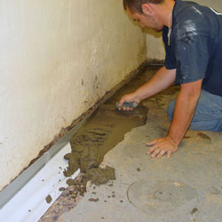 Testing a French drain system in a Woodside home.