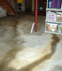 Flooding entering a basement through a floor crack in Rego Park