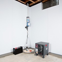 Sump pump system, dehumidifier, and basement wall panels installed during a sump pump installation in Ozone Park