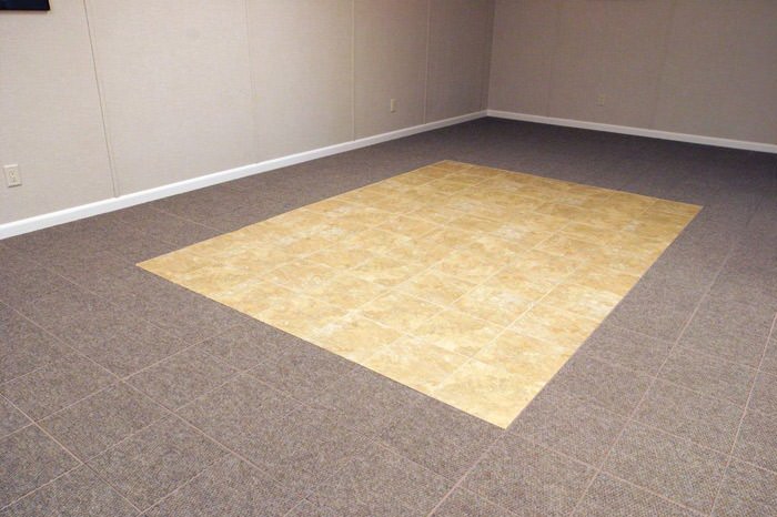 tiled and carpeted basement flooring installed in a Manhattan home