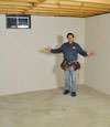 Astoria basement insulation covered by EverLast™ wall paneling, with SilverGlo™ insulation underneath