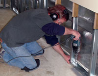 Replace wood studs with metal studs