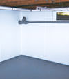 Bronx, NY wet basement wall covering that tucks into a perimeter drainage system